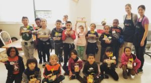 Liberty School children holding craft projects